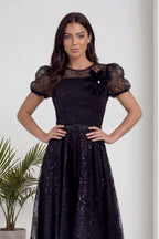 Siyah The ZKS abiye elbise, şeffaf balon kolları ve omuz çiçeği detayı ön planda